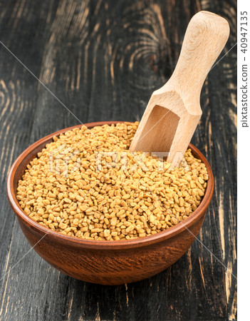 Grains of fenugreek in bowl Grains of fenugreek in bowl 40947135