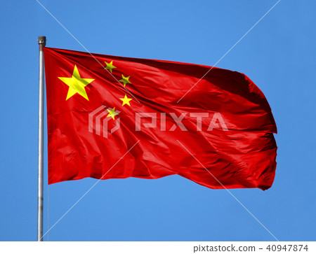 National flag of China on a flagpole in front of blue sky National flag of China on a flagpole in front of blue sky 40947874