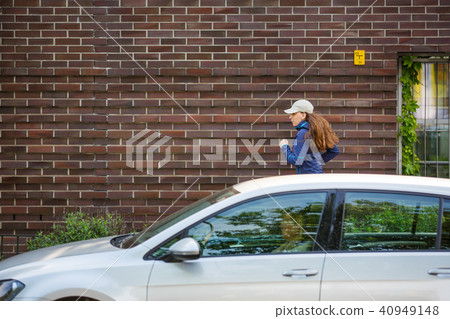 Young woman jogging along street in european city 40949148