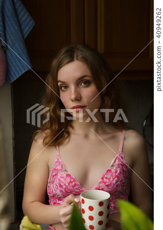 Red Hair girl with a cup of coffee. 40949262