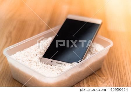 Water damaged phone in rice Water damaged phone in rice 40950624