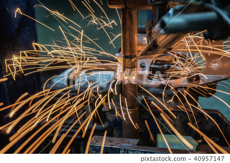 Spot machine is welding nut to automotive part 40957147