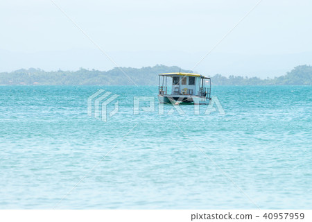 Lonely catamaran boat anchored on the sea 40957959