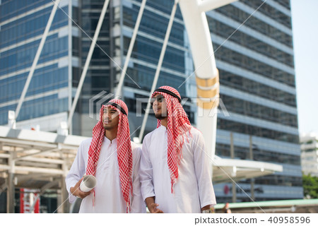Arab muslim engineer talk to consultants Arab muslim engineer talk to consultants 40958596