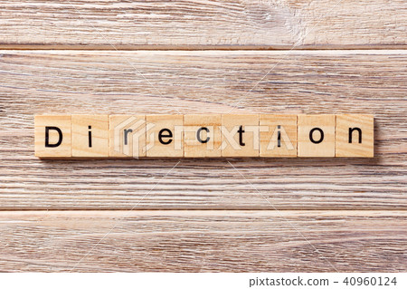 direction word written on wood block. direction word written on wood block. 40960124