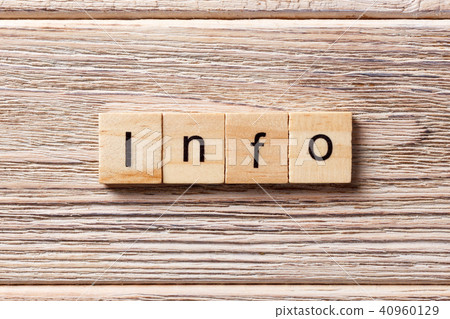 Info word written on wood block. 40960129