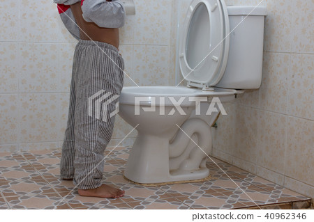 little asian boy urine in the toilet 40962346