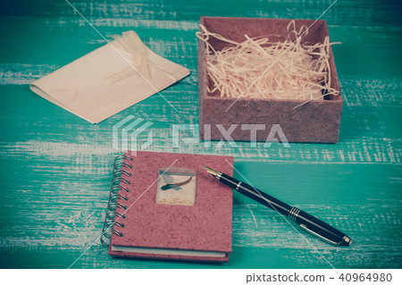 pink book note and paper box on wood background pink book note and paper box on wood background 40964980
