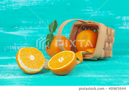 orange fruit on color table background. 40965644