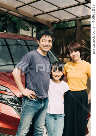 Three families standing side by side in front of car life family 40965818
