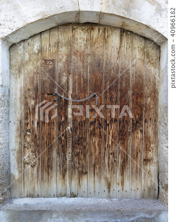 Ancient trapezoidal antique wooden doors  40966182