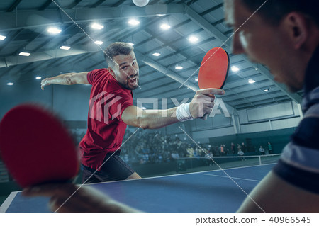The table tennis player serving 40966545