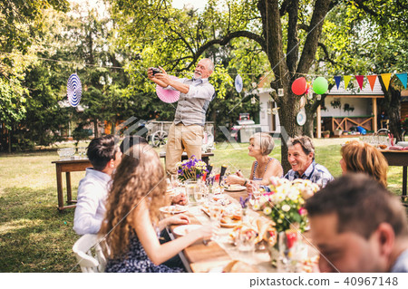 Family celebration or a garden party outside in the backyard. 40967148