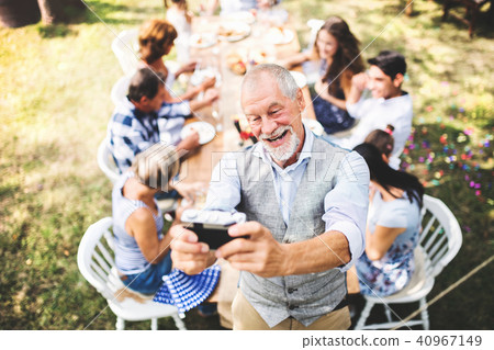 Family celebration or a garden party outside in the backyard. 40967149