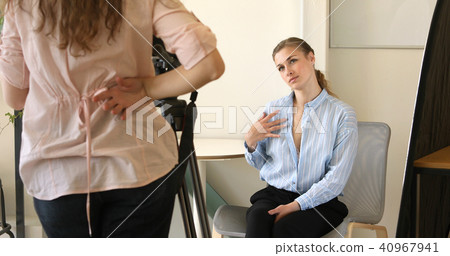 Young woman seducing colleague at work Young woman seducing colleague at work 40967941