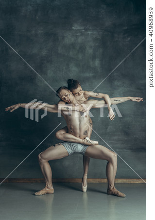 The young modern ballet dancers posing on gray studio background The young modern ballet dancers posing on gray studio background 40968939