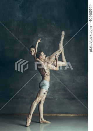 The young modern ballet dancers posing on gray studio background The young modern ballet dancers posing on gray studio background 40968944