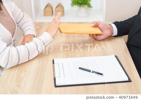 Customer rejecting money in envelope  40971649