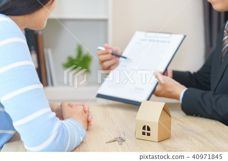 Businessman offers home loan contract agreement Businessman offers home loan contract agreement 40971845