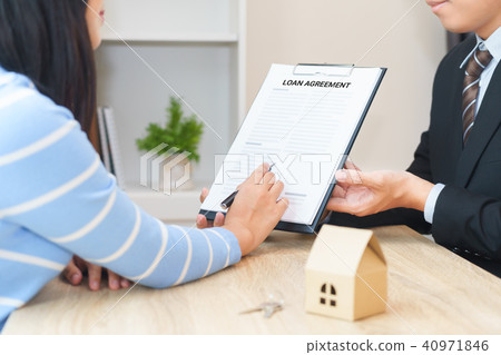 Businessman offers home loan contract agreement Businessman offers home loan contract agreement 40971846