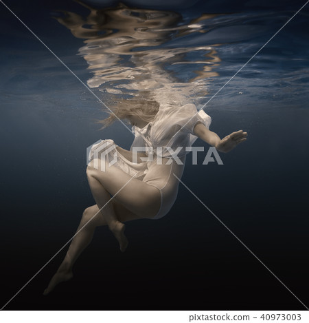 Woman in white dress under water Woman in white dress under water 40973003