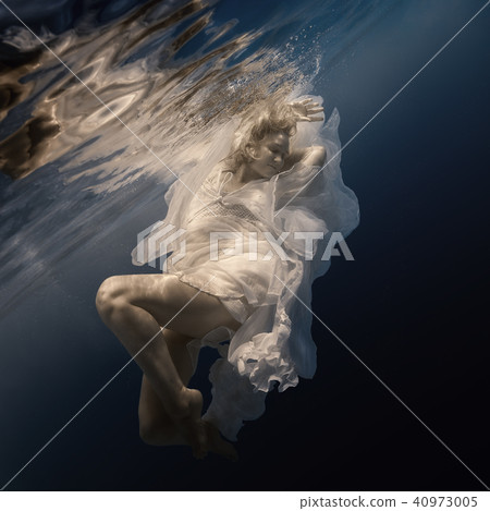 Woman in white dress under water Woman in white dress under water 40973005
