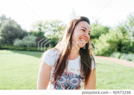 Outdoor atmospheric lifestyle photo of young beautiful lady. 40973286