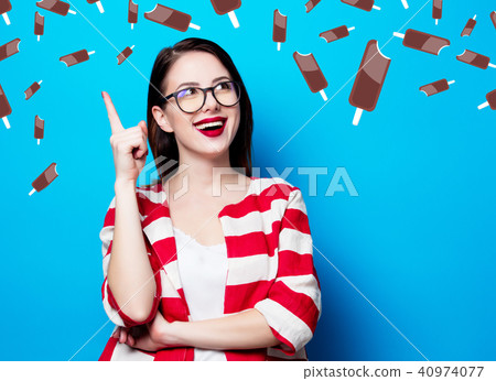 woman on the blue background with chocolade ice-cream 40974077