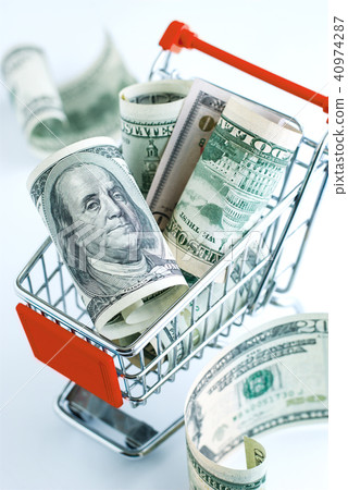 Dollars in a supermarket cart Dollars in a supermarket cart 40974287
