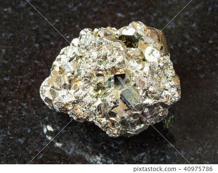 rough iron pyrite stone on black rough iron pyrite stone on black 40975786