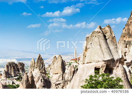 fairy chimney rocks and mosque in Uchisar town 40976586