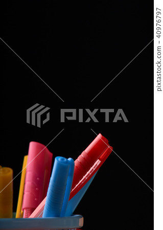 A glass with colored pens. Concept A glass with colored pens. Concept 40976797