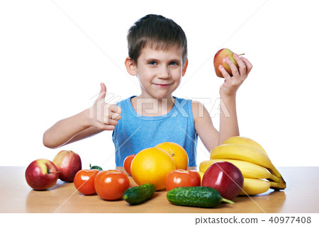 Happy healthy boy with fruits and vegetables 40977408