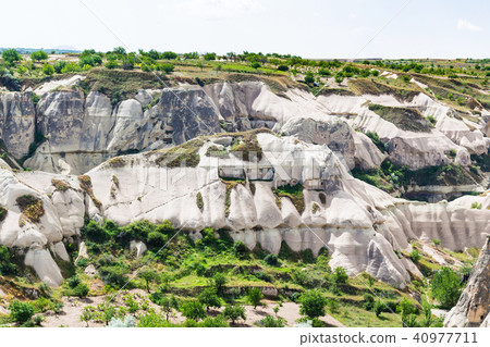 rock-cut houses on mountaion slope in Goreme rock-cut houses on mountaion slope in Goreme 40977711