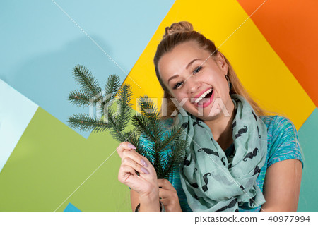 Cheerful woman with fir branches Cheerful woman with fir branches 40977994