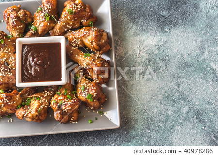 Chicken teriyaki wings with barbecue sauce 40978286