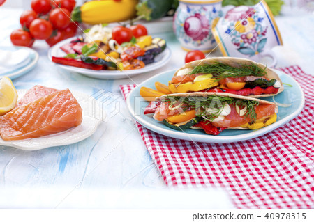 Mexican tacos with grilled vegetables and salmon. Healthy food for lunch. Fast food. Copy space 40978315