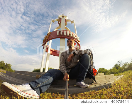 Selfie mania. A young guy takes a selfie on camera Selfie mania. A young guy takes a selfie on camera 40978444