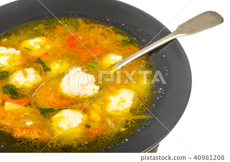 Soup with carrot, onion, paprika and meatballs Soup with carrot, onion, paprika and meatballs 40981208