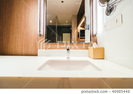 White sink and faucet water decoration in bathroom White sink and faucet water decoration in bathroom 40985448