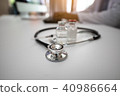 Stethoscope with Doctor working on desk computer 40986664