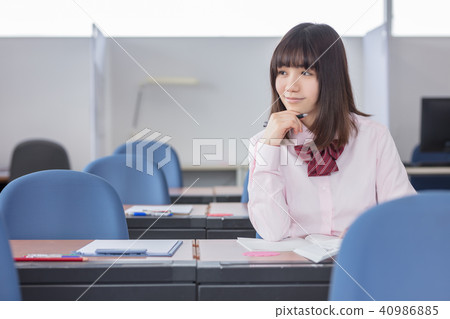 Girls high school students wearing summer clothes who are smiling at the cram school Girls high school students wearing summer clothes who are smiling at the cram school 40986885