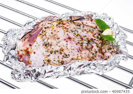 Piece of turkey in foil for baking 40987435