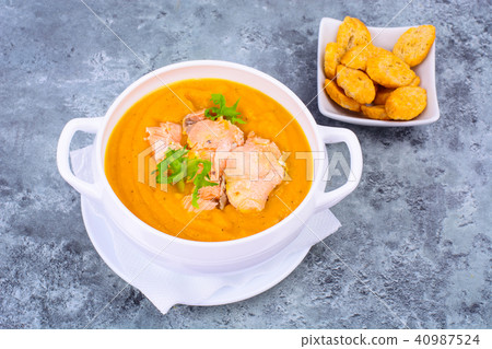 Pumpkin cream soup with slices of salmon Pumpkin cream soup with slices of salmon 40987524