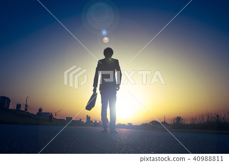 Businessman taking a morning sun Businessman taking a morning sun 40988811