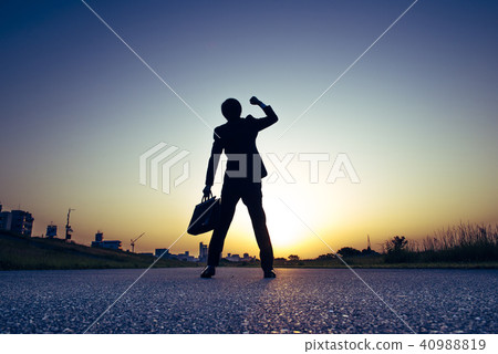 Businessman who plays guts pose Businessman who plays guts pose 40988819