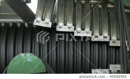 Manufacture of plastic water pipes. Manufacturing of tubes to the factory. The process of making 40988965