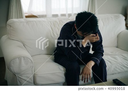 Middle-aged man in depressed pajamas Middle-aged man in depressed pajamas 40993018