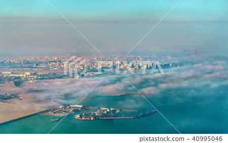 Aerial view of Doha through the morning fog - Qatar, the Persian Gulf Aerial view of Doha through the morning fog - Qatar, the Persian Gulf 40995046