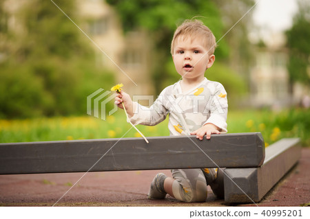 Portrait of adorable baby playing at playground Portrait of adorable baby playing at playground 40995201